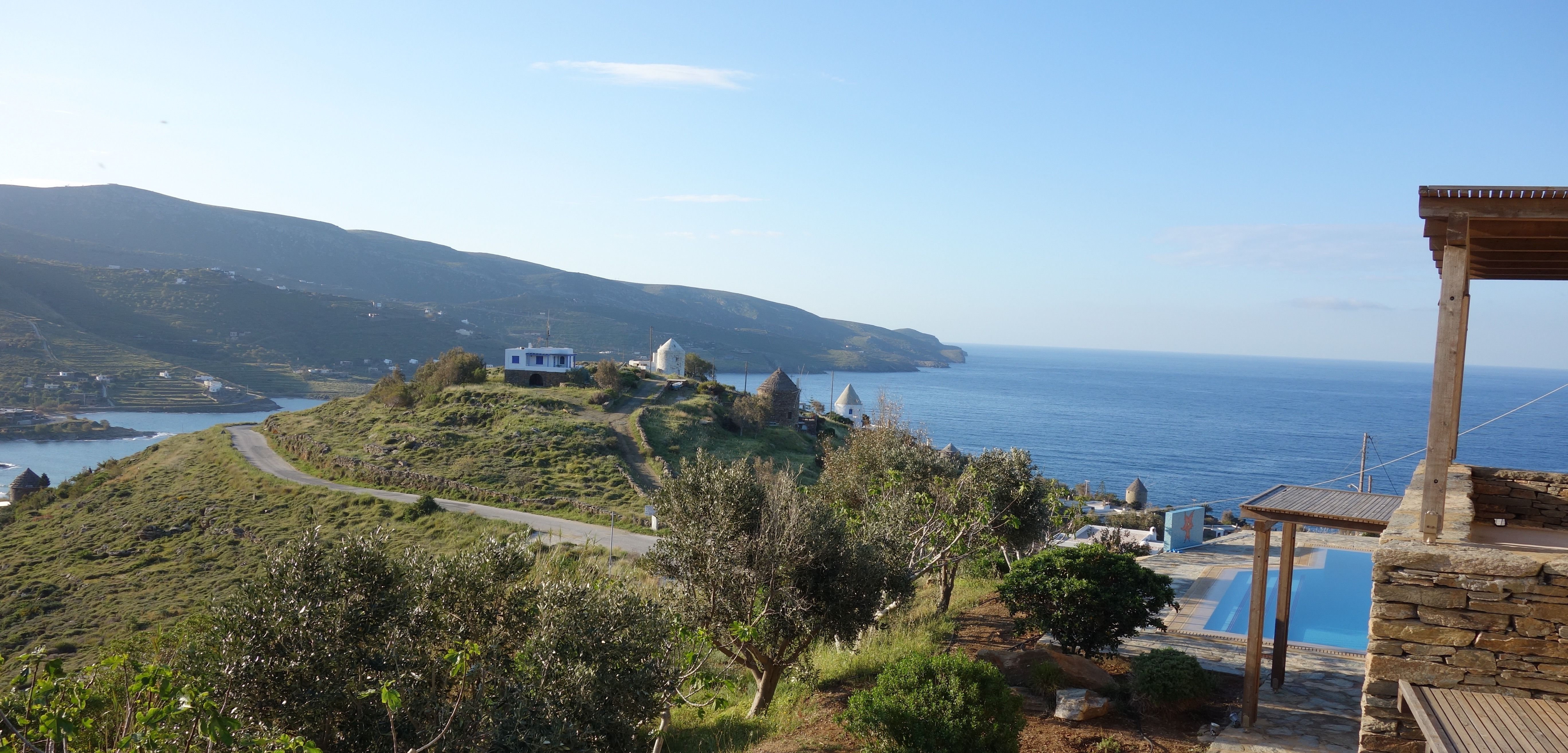 Wide panorama of Koundouros bay and the Aegean coastline from the villa terrace