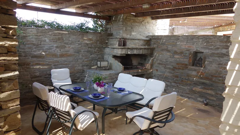 Courtyard BBQ area with built-in grill and stone surround