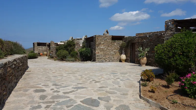 Driveway approach to the villa entrance through mature gardens