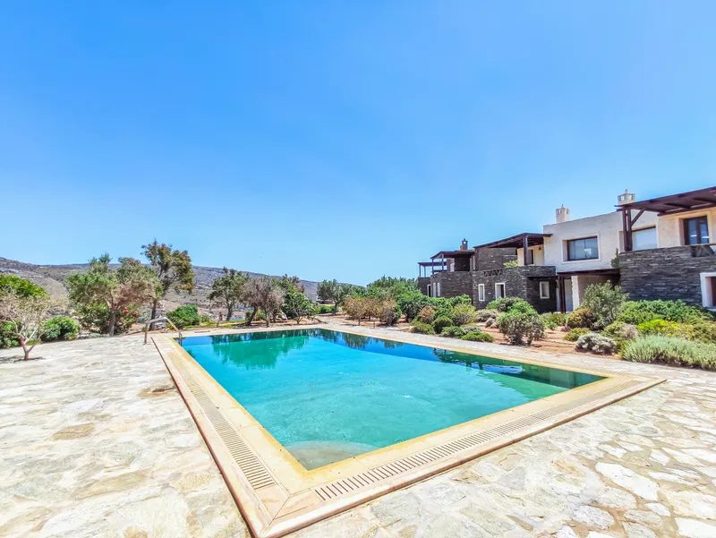 Wide-angle view of the pool terrace and surrounding gardens